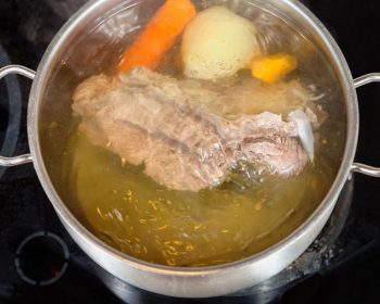 veggies in a simmering pot of water