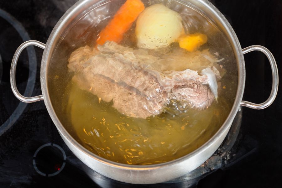 veggies in a simmering pot of water